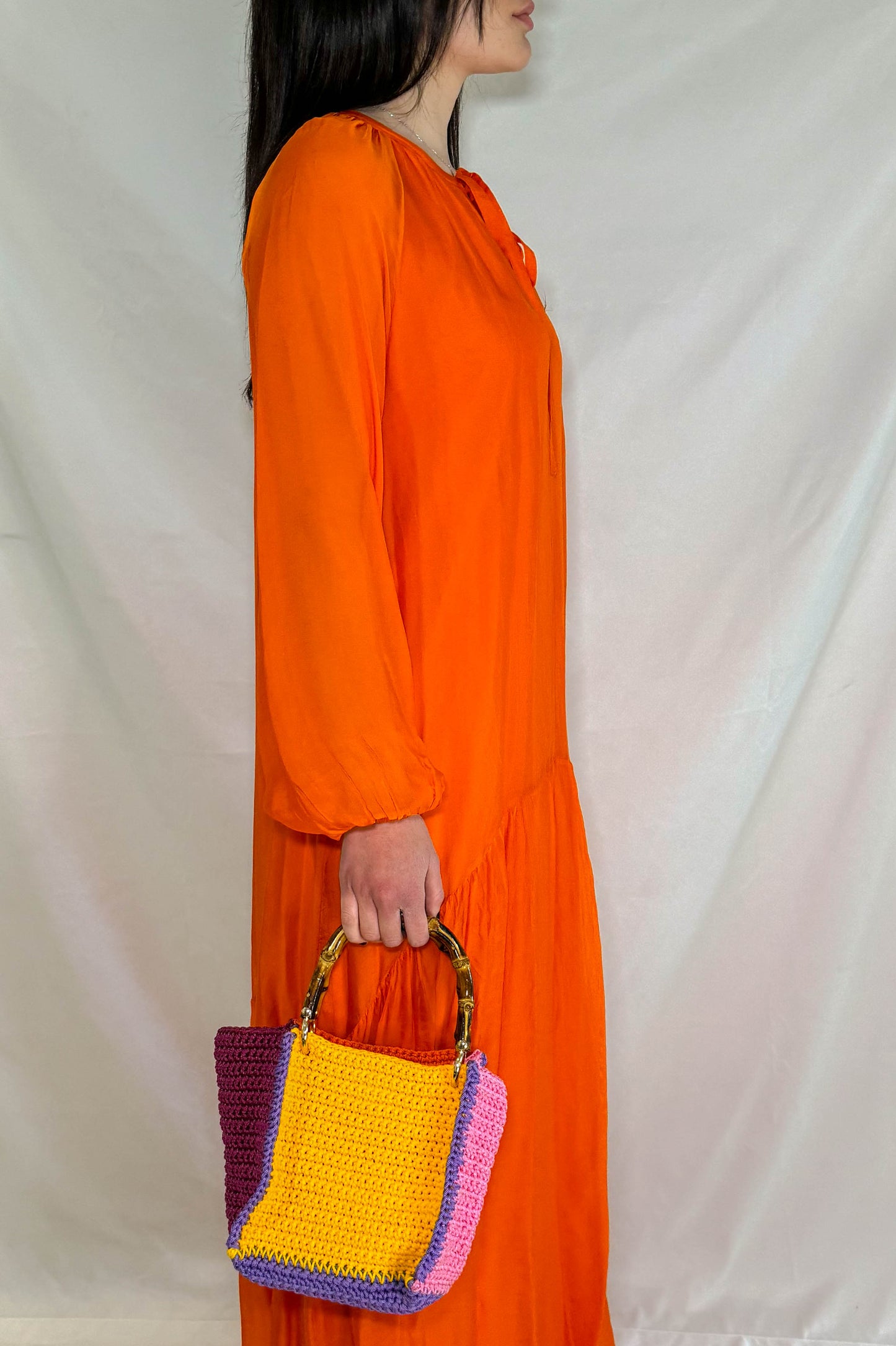 Abito lungo Pepita in arancione frontale per serate eleganti